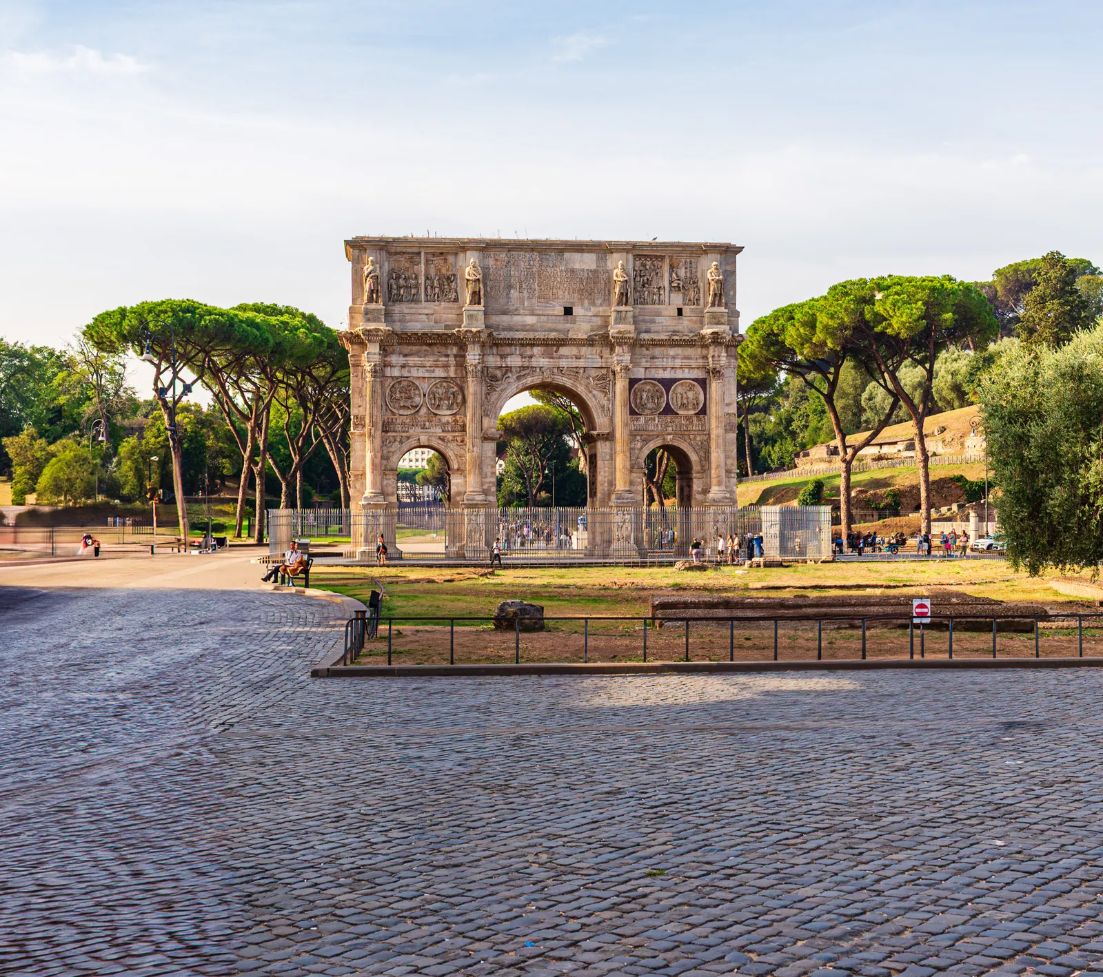 The grand triumphal Arch of Constantine framed against the sky