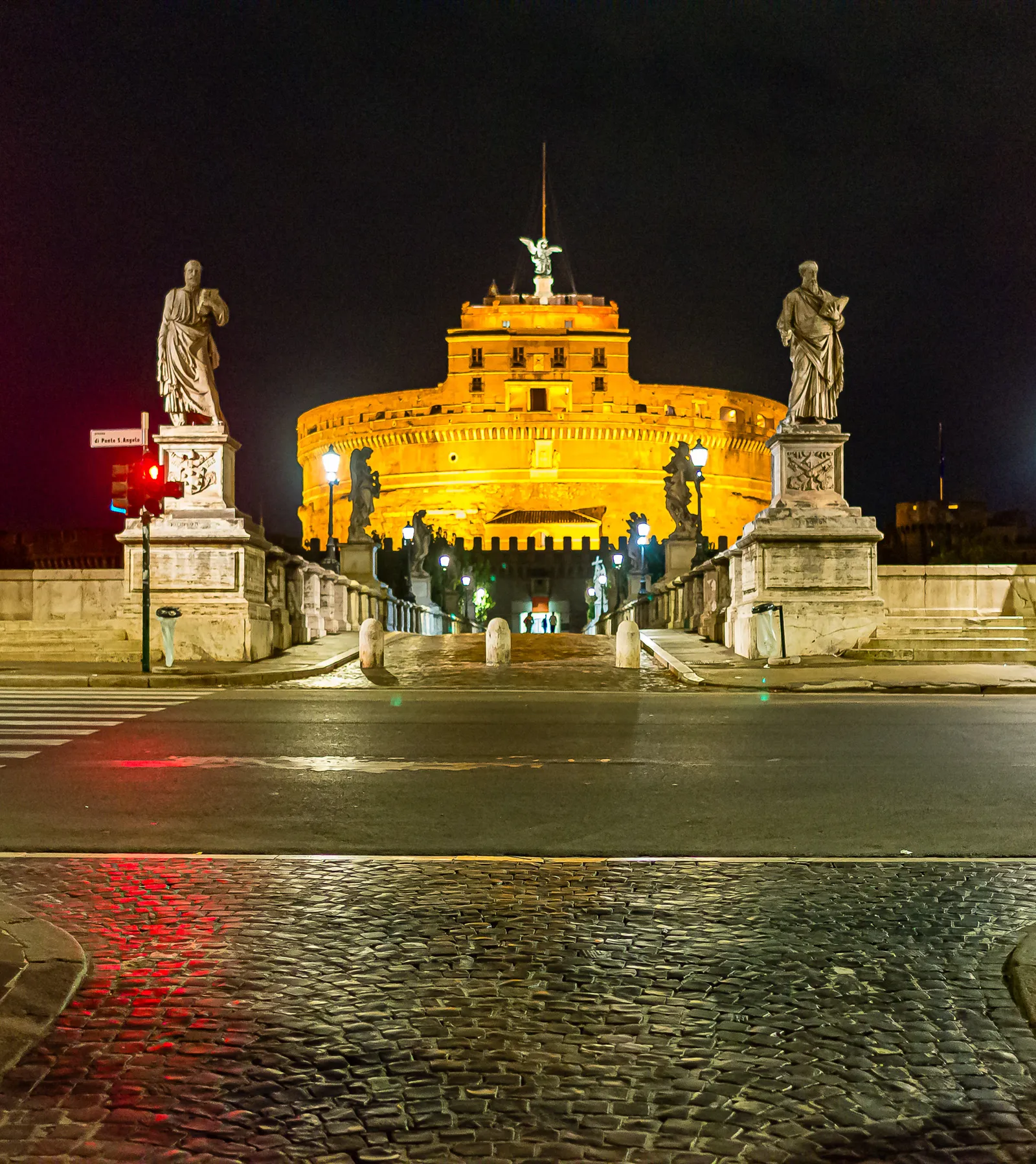 View of the Castel Sant Angelo at night, with the illuminated lighting