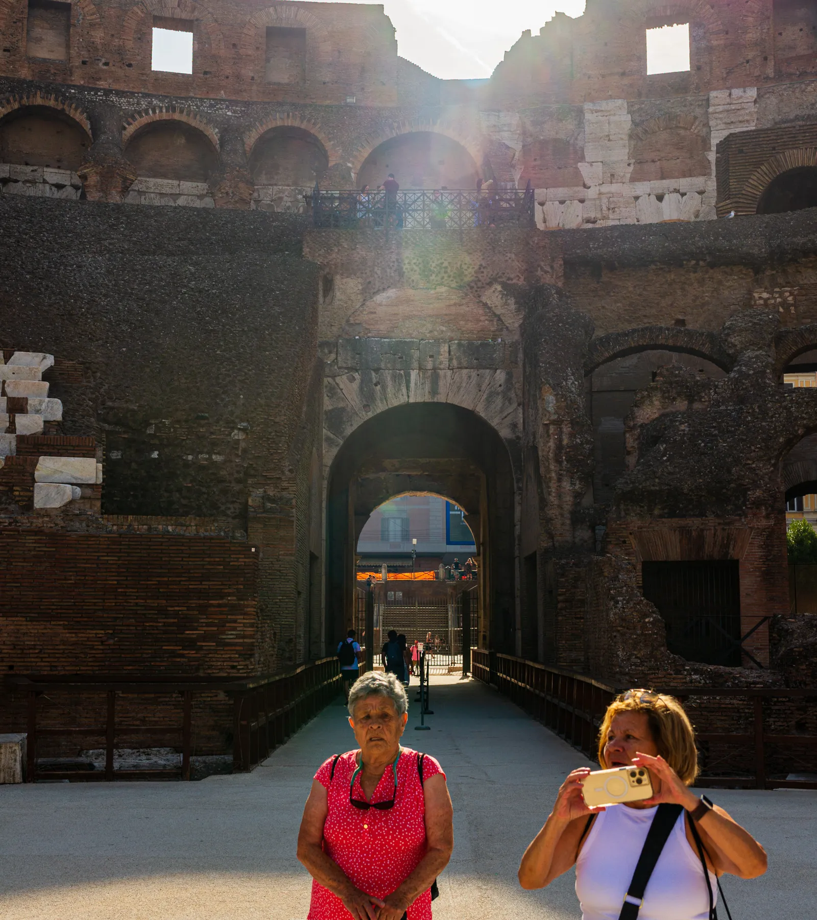 Candid family moment exploring together inside the upper tiers of the Colosseum