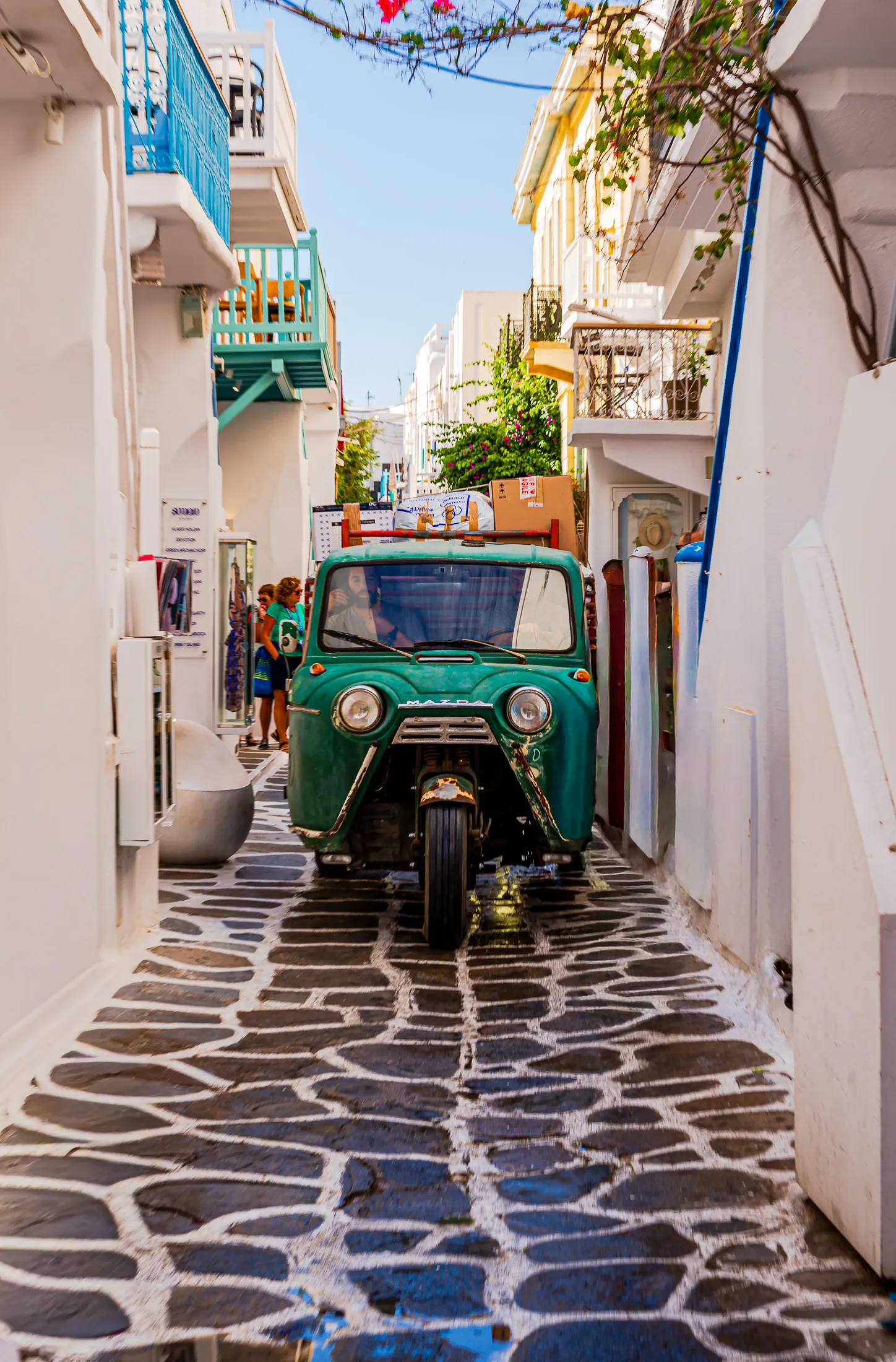 Mykonos white washed three wheeled pickup.BGZpt8eU