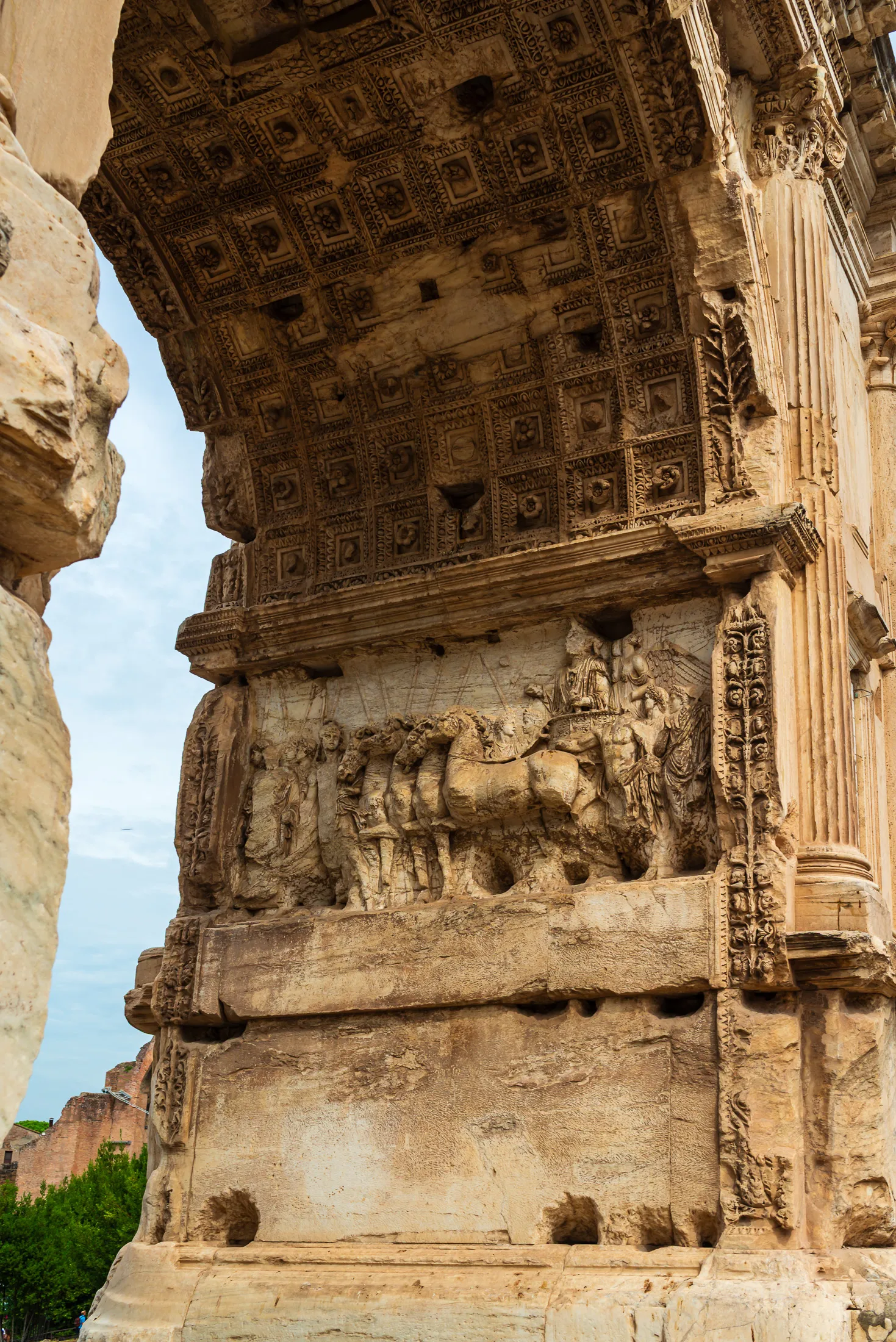 Detailed stone carving showing the triumph chariot panel relief on the Arch of Titus