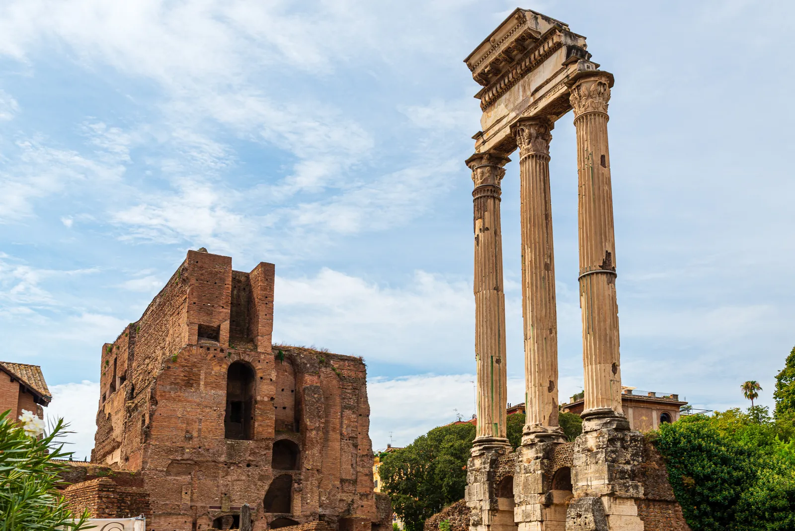 The three iconic standing Corinthian columns of the Temple of Castor and Pollux ruins