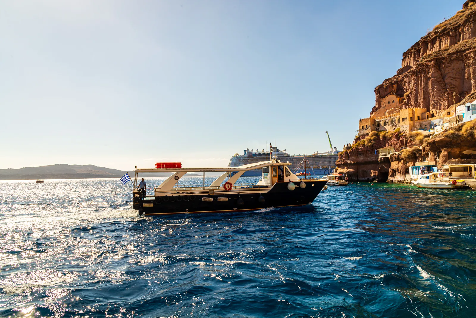 Santorini boat ocean.jWi0GDbS