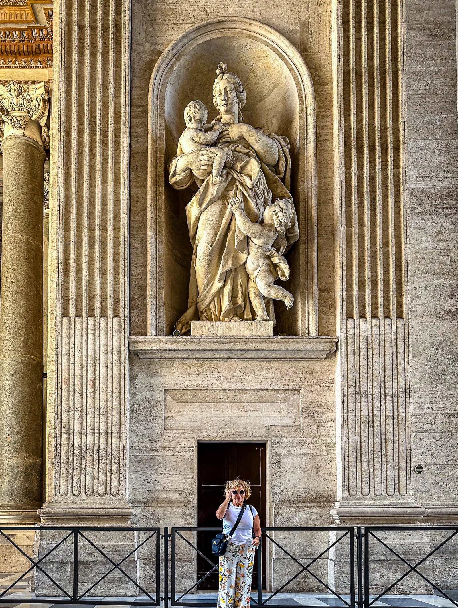 My aunt Sara next to a pillar in St. Peter's Basilica